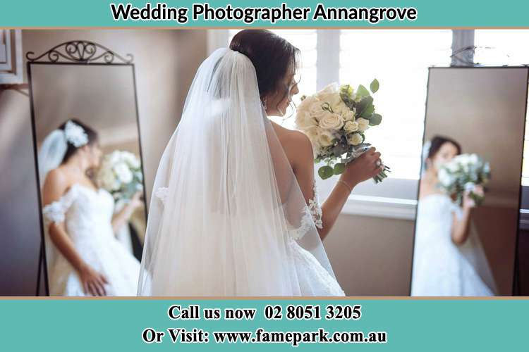 Photo of the Bride holding flower in front of the mirrors Annangrove NSW 2156